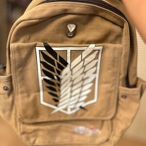 Tan Canvas Backpack with Emblem
